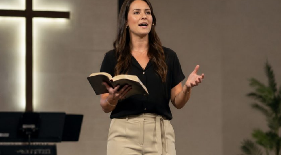 Preacher speaking with an open Bible